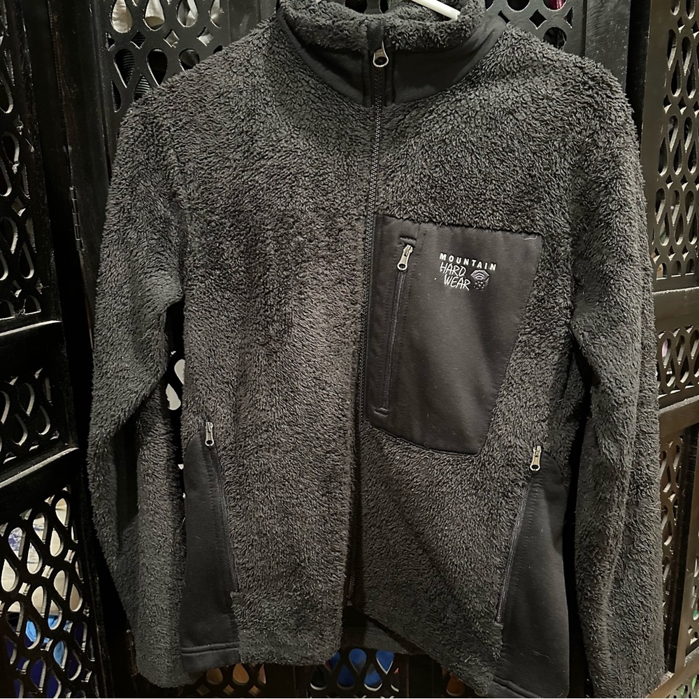 Youth size large, black, fleece jacket by Mountain Hardware